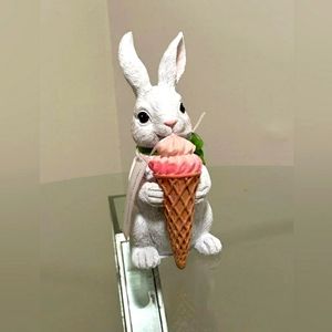 Cupcakes and cashmere Easter Bunny holding an ice cream